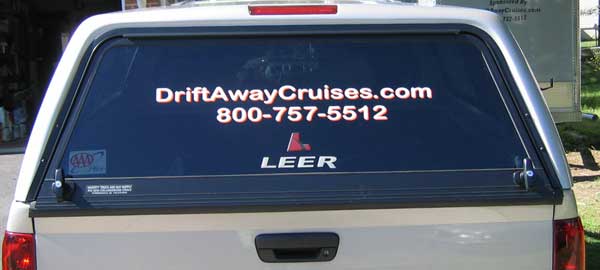 Rear Window of a Pickup Topper with Custom Lettering Rear Window of a Pickup Topper with Custom Lettering